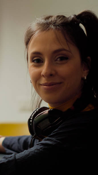 istock Concentrated gamer looking at camera while playing space shooter video game 1811509271