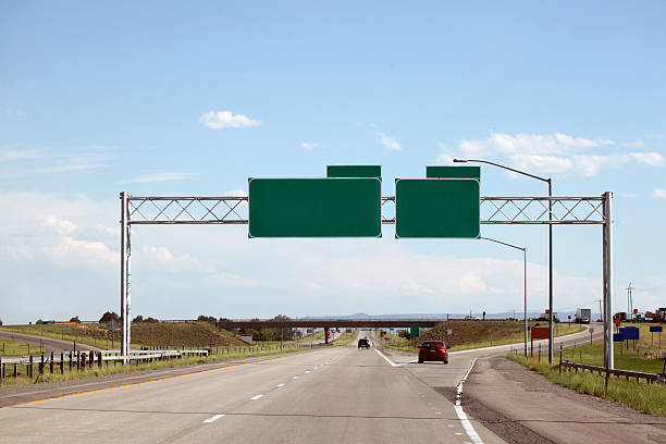Highway and green signs with clipping path Clipping path around 4 green signs, 2 horizontal connecting bars and pole on right. exit sign photos stock pictures, royalty-free photos & images