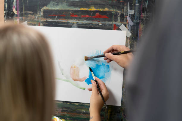 istock young woman on the offline drawing course, studying to paint 1811511682