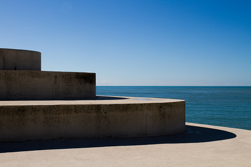 Architectural structure in the form of steps against the backdrop of the sea