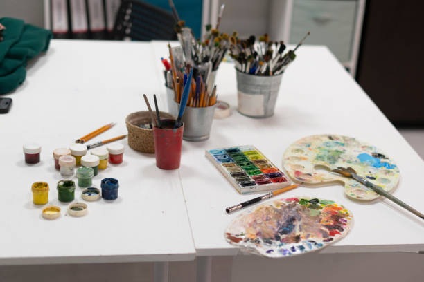 istock artist's workplace in the studio with different paints and brushes 1811512306