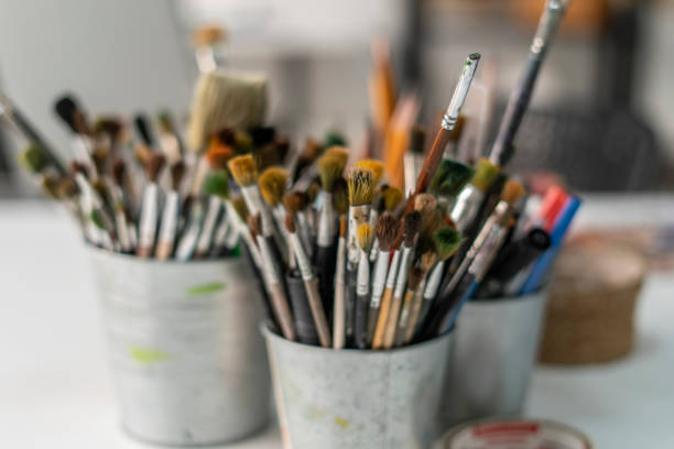 istock Set of artistic brushes in a jar, professional artist's tools in the workshop 1811512309