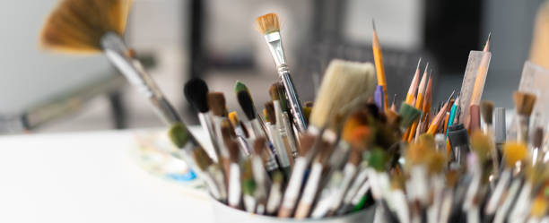 istock Set of artistic brushes in a jar, professional artist's tools in the workshop 1811512311