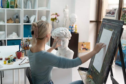 artist drawing the classic ancient bust sculpture