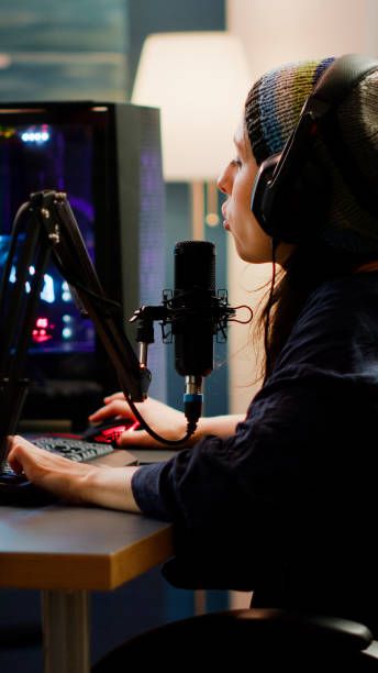 istock Streamer putting on headphone and start talking into microphone 1811513977