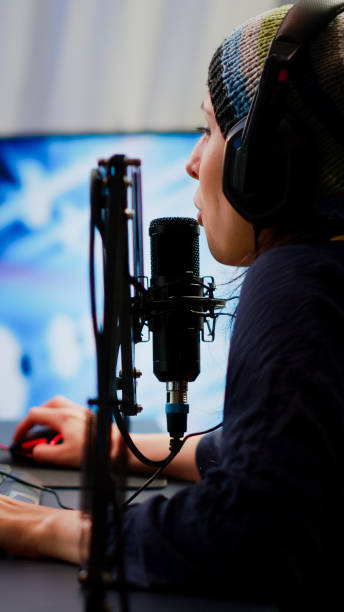 istock Pro cyber woman talking at streaming professional microphone 1811514634