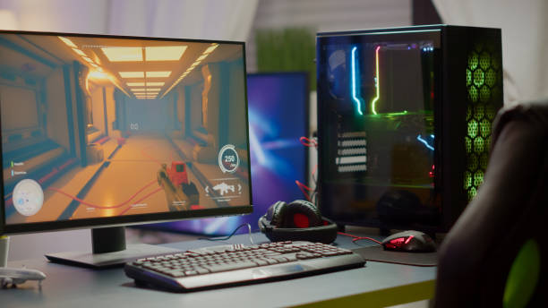 istock RGB powerful computer with first-person shooter game on screen 1811515365