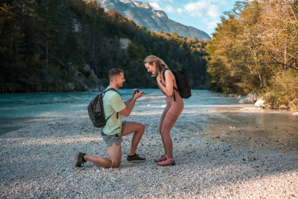 istock Caucasian Couple's Proposal by the River 1811515385