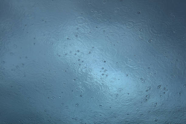 Rain  on the water seen from below the surface
