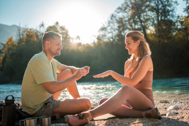 istock Caucasian Man Proposes by the River 1811518231