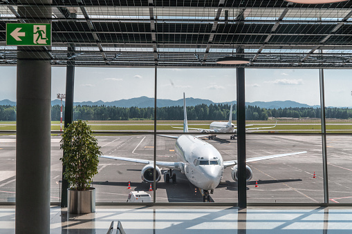 Modern airport terminal building over blue sky background