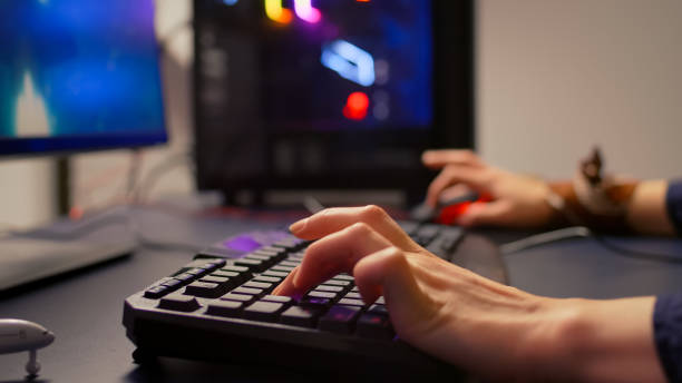 istock Close-up of gamer using RGB keyboard and mouse 1811527135