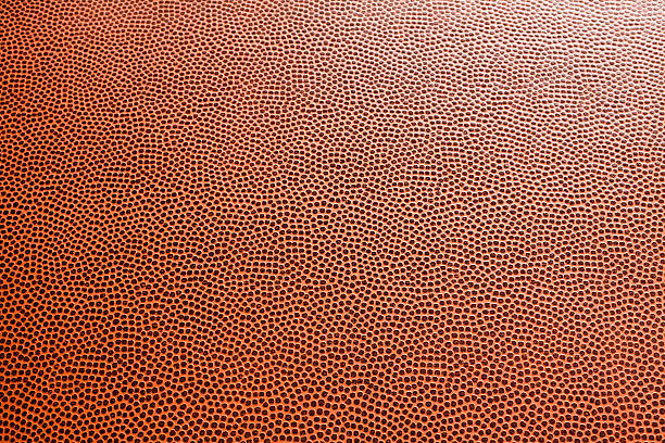 Orange honeycomb textured background Closeup of American football leather for background pigskin stock pictures, royalty-free photos & images