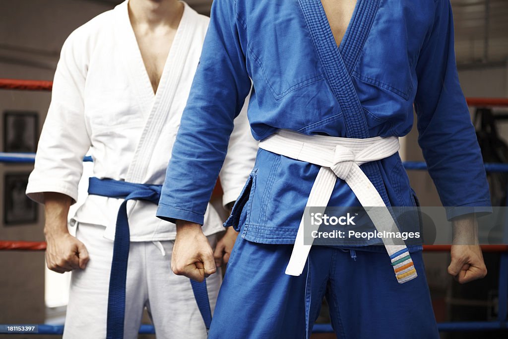 Stand your ground Two judo fighters stand their ground with fists ready to fight - cropped Judo Stock Photo