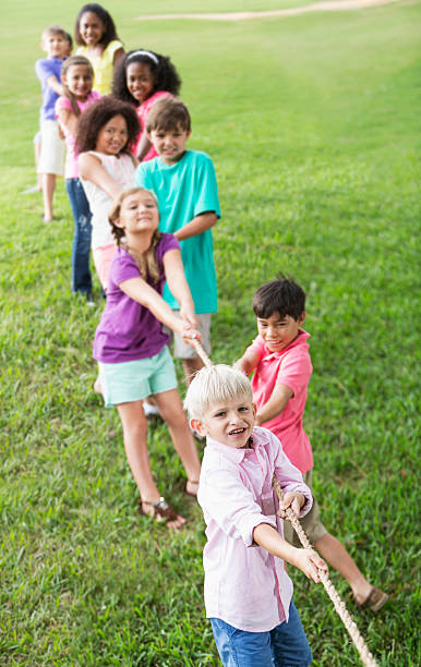 istock Children playing tug of war 181153784