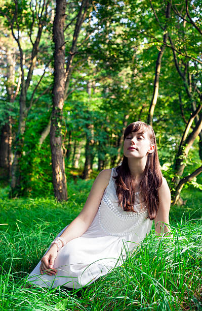 istock Young woman relaxing in the forest 181153938