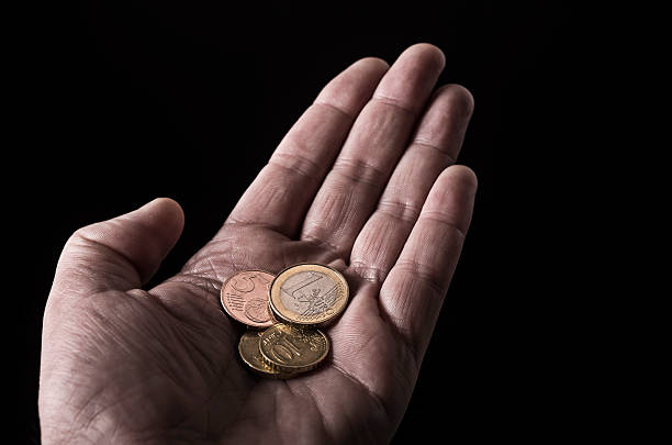 Hand with coins stock photo