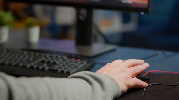 istock Close-up of man hands gamer playing video game using RGB keyboard 1811542765