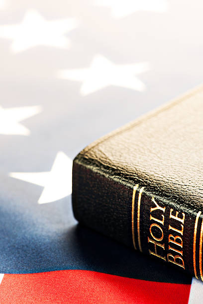 istock Holy Bible with American Flag 181154450