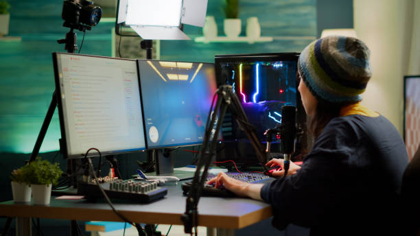 istock Professional woman streamer playing FPS games talking into microphone 1811544884