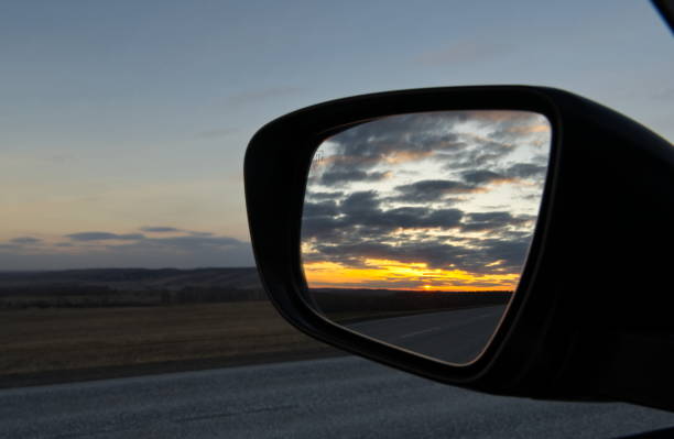 istock Sunset in the mirror and in reality 1811545647