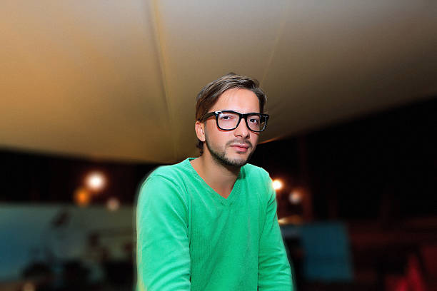 Young male with glasses. Fine film grain texture.