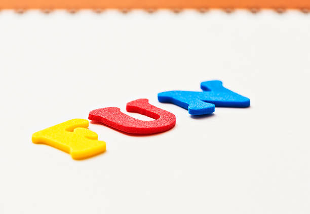 istock Angled view of play alphabet spelling FUN on white background 181155178