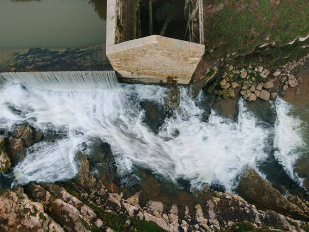 istock Abandoned mill with waterfall as seen from above 1811553202