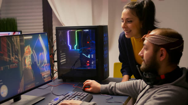 istock Pro gamer couple playing first person video game 1811557047