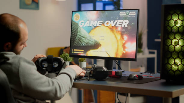 istock Videogamer losing graphics cyberspace video game sitting on gaming chair 1811567834