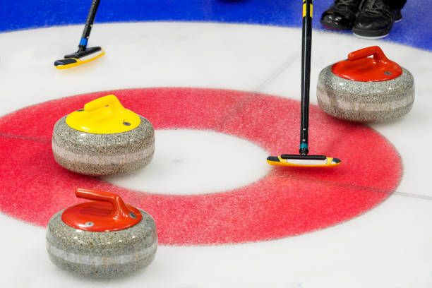 istock Curling stones in the target house 1811602782