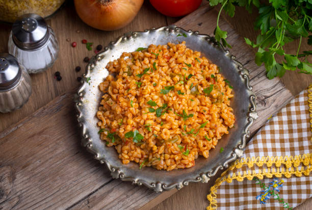 istock Traditional turkish bulgur pilaf with tomato sause in plate (Turkish name; meyhane pilavi) 1811610472