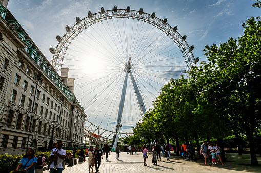 London, United Kingdom - May 28, 2023:  The London Eye Millenium Wheel. Many tourists walking there.