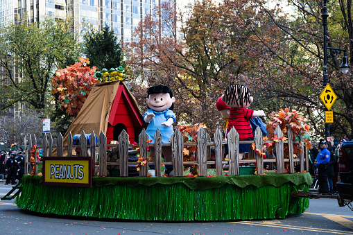 Peanuts float goes down Central Park South at the Macy's Thanksgiving Day Parade 2023 in NYC.