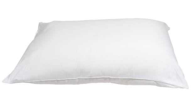 istock White pillow without case after guest's use in hotel or resort room isolated on white background with clipping path, Concept of comfortable and happy sleep in daily life 1811640134