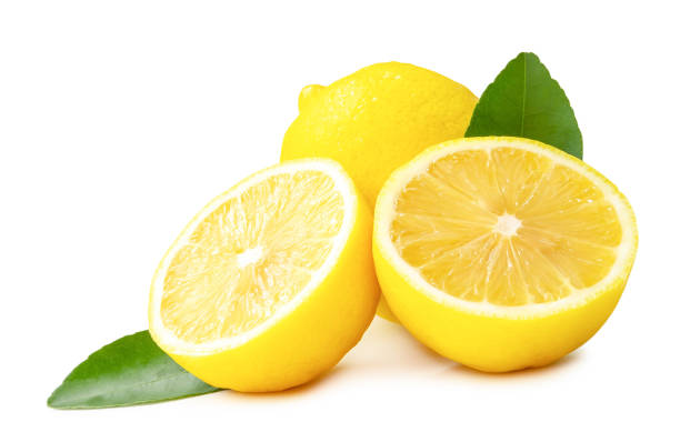 istock Whole fresh yellow lemon with halves and leaves in stack isolated on white background with clipping path 1811640160