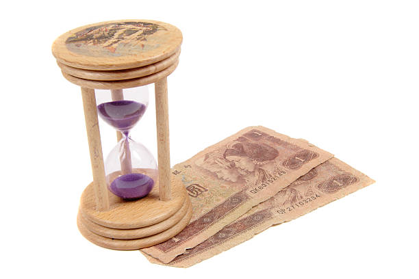 istock Hour Glass wiyh money isolated 181164069