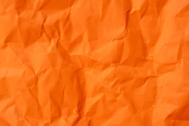 istock Orange crumpled paper texture used for paper background texture in decorative art work 1811641309
