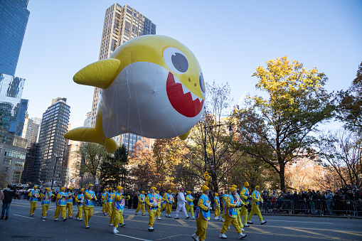Wide angle view of the Baby Shark balloon in the Macy's Thanksgiving Day Parade 2023 in New York City.