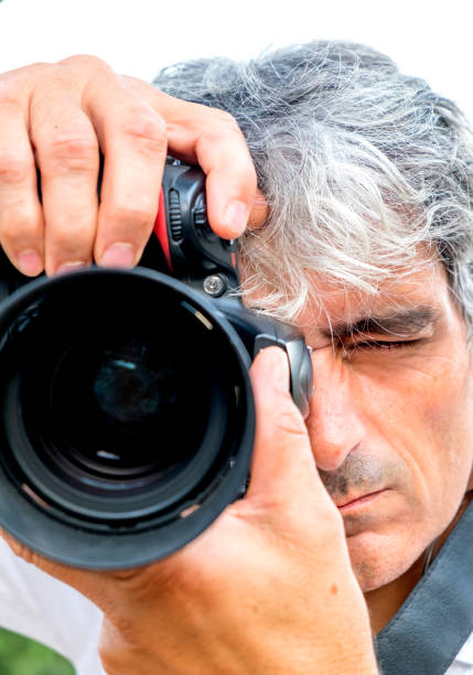 istock Close-up attractive white hair man making photos. 1811641476