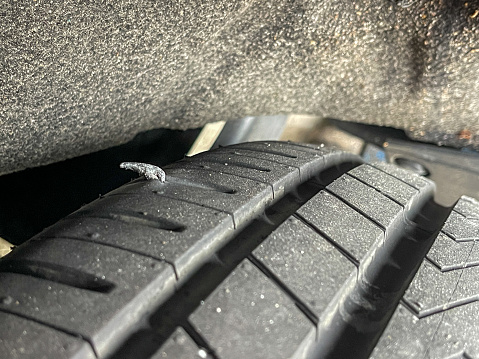 Close up view of pierced tire