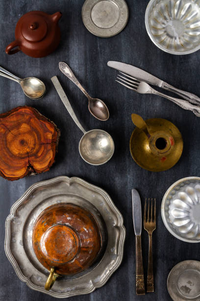 istock Various antique vintage dishes on black background 1811651461