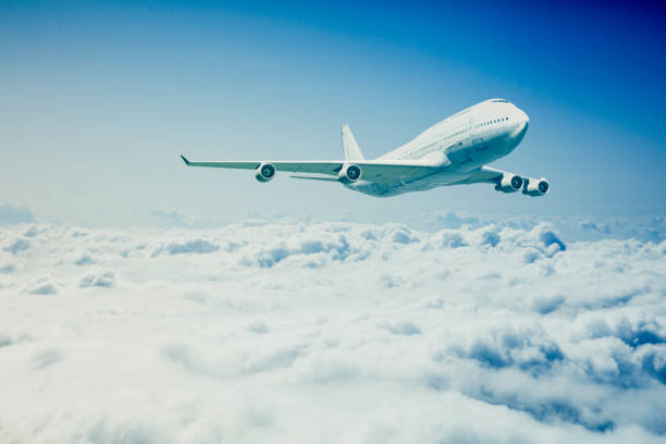 istock commercial airplane flying over the clouds 1811651516