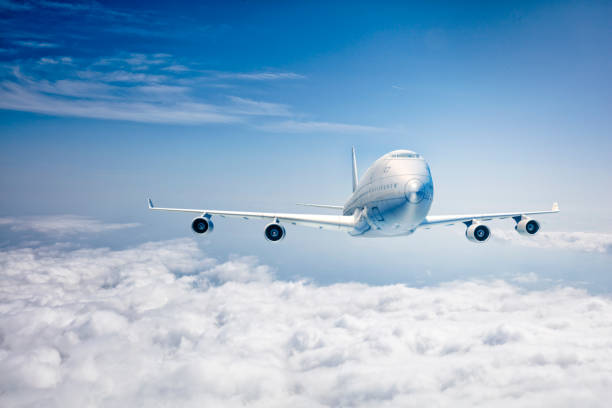 istock commercial airplane flying over the clouds 1811651520