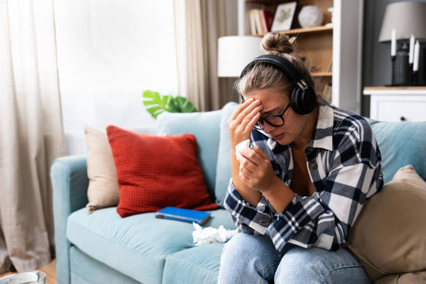 istock Sad tired young woman touching forehead having headache migraine or depression, upset frustrated girl troubled with problem feel stressed cover crying face with hand suffer from grief sorrow concept 1811658855