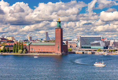 View of the red brick Stockholm City Hall on a bright sunny day. Sweden.