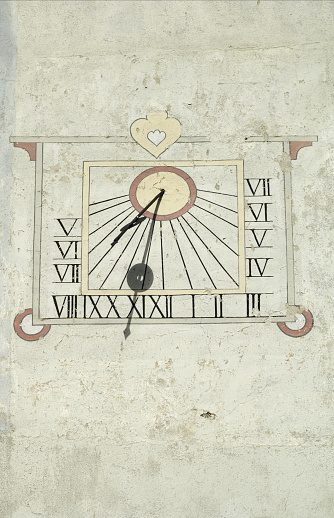 Sundial on church at Rossinière