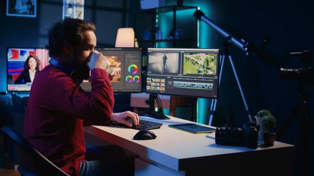 istock Videographer adjusting clips while enjoying cup of coffee in office 1811698369