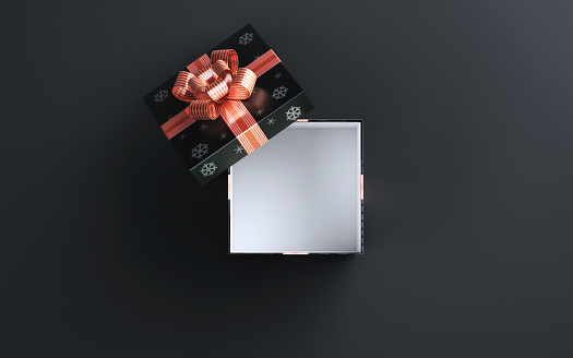 3d Render Open Gift Box with Orange Striped Ribbon and Snow Pattern sitting on a Black Embossed Background, Can be used for new year, valentine's day, happy birthday concepts. (Close-up)