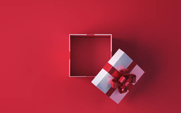 istock White Open Gift Box with Red Ribbon Sitting on Red Soft Backdrop Background Red Color Inside 1811707153